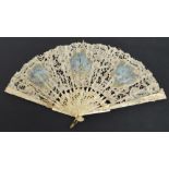 A 19th century European folding fan with pierced carved and gilt heightened guards with floral