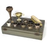 A collection of items to include napkin rings, a hand brush,