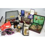 A quantity of costume jewellery, some in jewellery boxes, to include vintage necklaces,