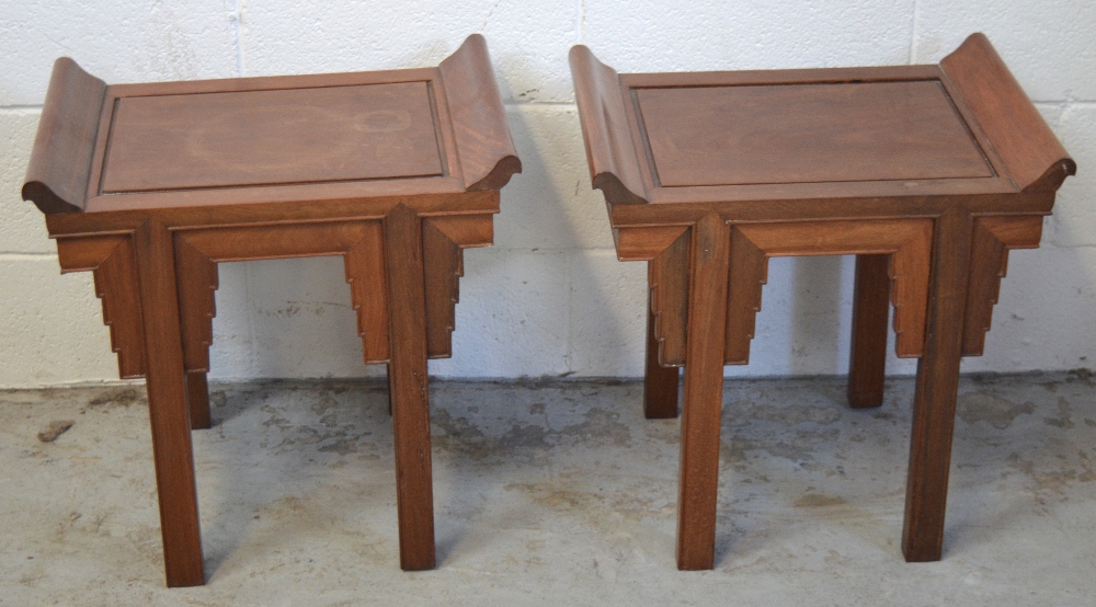 A pair of Chinese hardwood stools with stepped aprons, dimensions of seats 50 x 35cm.