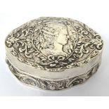 A continental silver box with a vignette of a young woman among olive branches and scrolls,