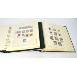 Two albums of stamps from Switzerland and Denmark,