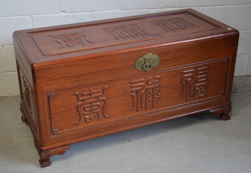 A large Chinese hardwood blanket box,