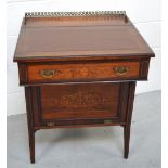 A c1900 rosewood and inlaid desk of small proportions with leather inset top and gilt metal gallery,