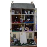 A Georgian style double fronted doll's town house, basement area with servant's room and kitchen,