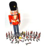A boxed wooden model and a quantity of lead figures to include Britains.