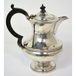 A George V hallmarked silver coffee pot, Birmingham 1932, approx 14ozt, height 20cm (finial af).