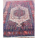 An antique Persian Toyserkan rug, 204 x 127cm.