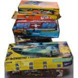 Ten boxed sets of Scalextric to include Formula 1 and the Simpsons examples.