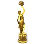 A painted spelter figural lamp modelled as a young girl on rounded base, height 77cm (af).