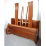 A reproduction shaped double bed, width 170cm.