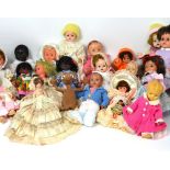 A large quantity of composite and hard plastic dolls to include a French boy doll, Pedigree dolls,