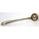 A George III hallmarked silver sifting spoon of small proportions, maker Hester Bateman,