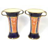 A pair of c1900 Moorcroft MacIntyre Aurelian waisted twin handled vases, height 26cm (2).