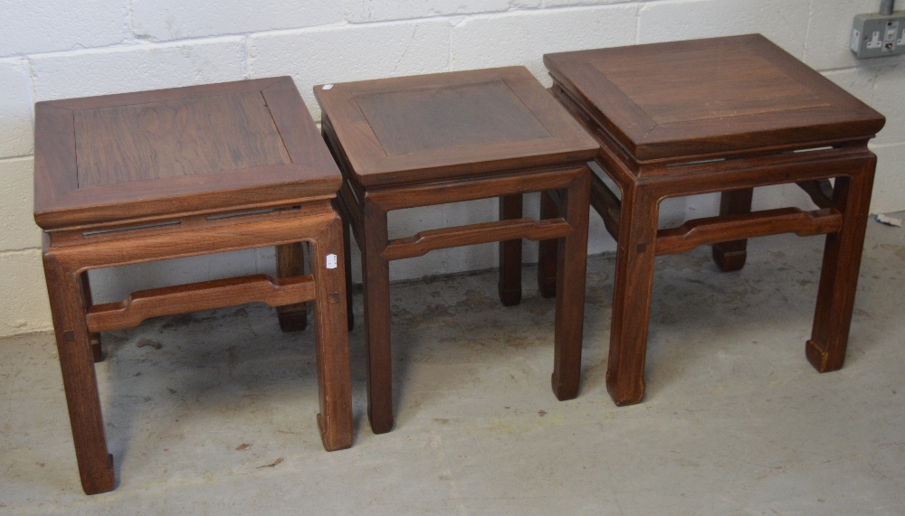 A pair of Chinese hardwood square occasional tables,
