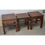 A pair of Chinese hardwood square occasional tables,