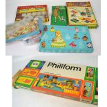 A Philiform boxed set, a weaving loom, a collection of international dolls,