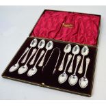 A cased set of twelve Edward VII hallmarked silver teaspoons and a pair of matching sugar tongs,