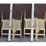 A pair of cream painted gilt heightened bergère single beds, width of both approx 95cm (2).