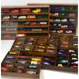 Two display cases and five wooden trays containing largely advertising vehicles to include Corgi,