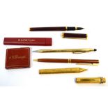 A Cartier ball pointpen with accessories to include cartridges,