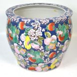 A large 20th century Oriental jardinière cobalt blue ground decorated with fruits in oranges,