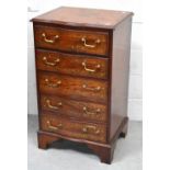 An Indian rosewood serpentine front five drawer chest of drawers inlaid with brass,