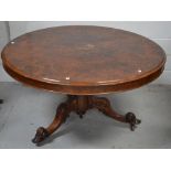 A burr walnut loo table on carved pedestal base,