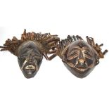 Two African carved masks, possibly from the Dan tribe, Africa, both measure 35cm long.