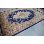 A reproduction blue ground Tabriz carpet, 280 x 200cm.