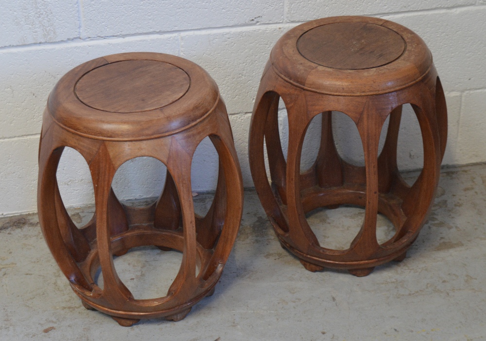 A pair of Chinese hardwood circular low stools, diameter of seats 29cm.