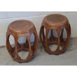 A pair of Chinese hardwood circular low stools, diameter of seats 29cm.