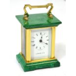 A small reproduction Garrard & Co seventeen jewel carriage clock, the dial set with Roman numerals,