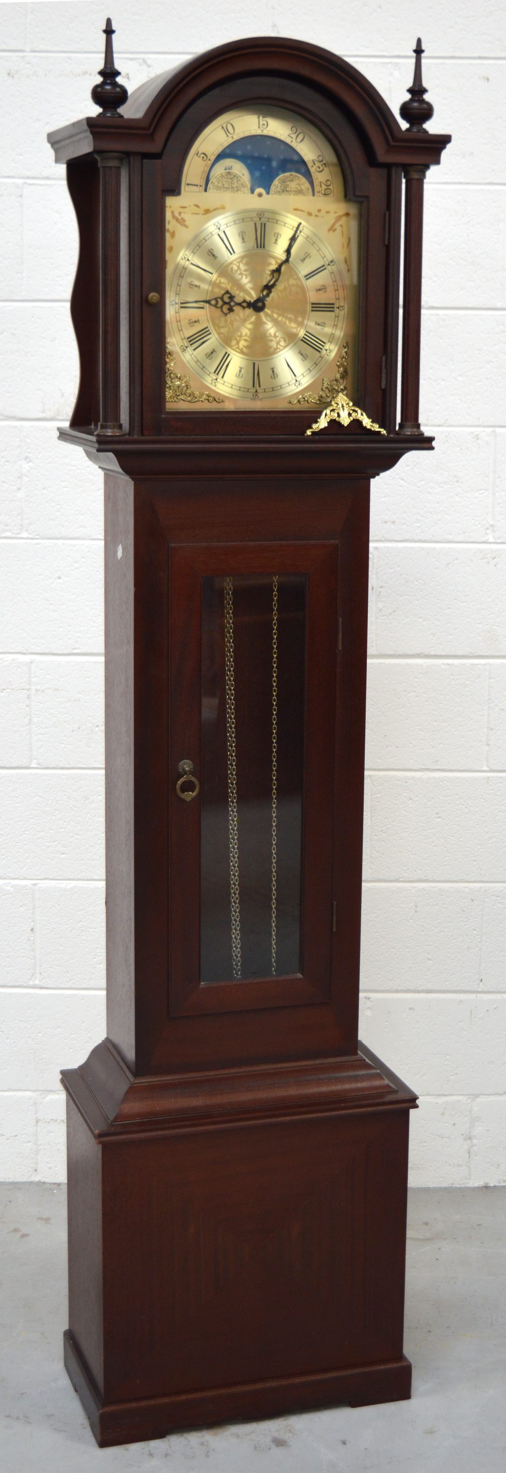 A reproduction mahogany long case clock,