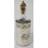 An Edward VII hallmarked silver bottle holder with bottle for oil, maker Henry Matthews,