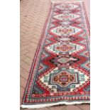 A vintage Caucasian runner, 344 x 85cm.