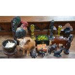 A quantity of treen to include an African figurine, elephant figures, bowls, candlesticks,