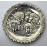 An Edward VII hallmarked silver pin dish decorated with angel's faces, Birmingham 1901,