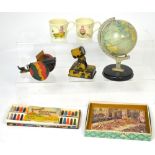 A miniature Chad Valley table globe, a boxed 'Victory' coronation jigsaw puzzle, a model cannon,