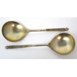 A pair of David Andersen second period spoons with female face finials, length 16cm,
