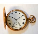 A 9ct gold crown wind full hunter pocket watch the enamel dial set with Roman numerals and
