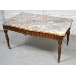 A mahogany coffee table with marble top on reeded legs terminating in castors with faux metal trim