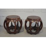 A pair of Oriental round hardwood stools.