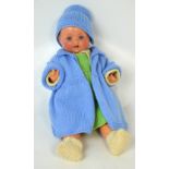 An Armand Marseille 520 bisque head doll with open and close blue eyes,