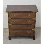 A small Chinese elm chest of four long drawers, with applied brass mounts, width 59cm, height 65cm.