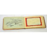 A twenty-seven page autograph book containing autographs to include Noel Coward, Anna Neagle,