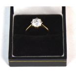 A ladies' 9ct gold dress ring set with one white solitaire stone, size N, approx 3g.
