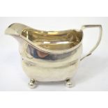 A George III hallmarked silver jug on ball feet, London 1808, approx 3.9ozt, length 15cm.