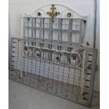 A white painted cast iron collapsible double bed on castors, width 139cm.