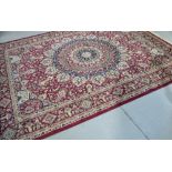 A reproduction red ground Keshan carpet, 280 x 200cm.